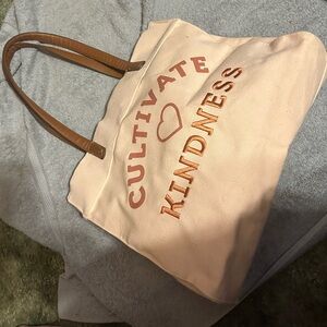 Cultivate Kindness Canvas Tote Bag in Light Pink with Brown Handles